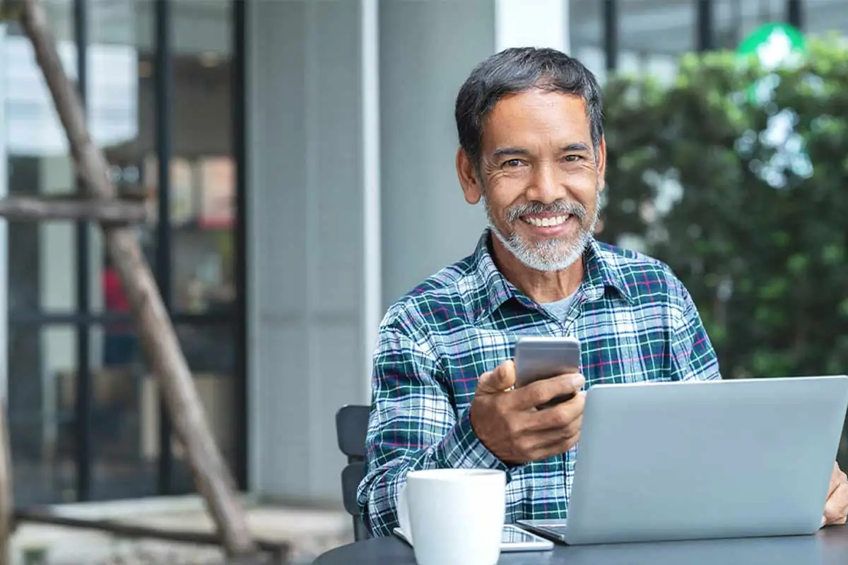 man scheduling his appointment at Gaither Perio and Implants