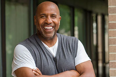 man smiling after gum recession treatment