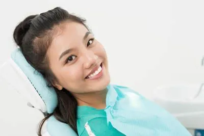 woman smiling in the dental chair at Gaither Perio and Dental Implants