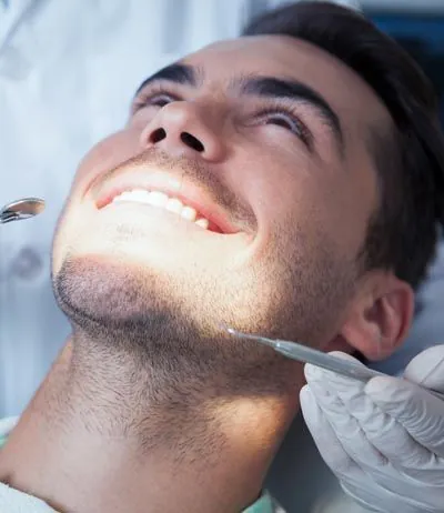 man smiling during his dental procedure