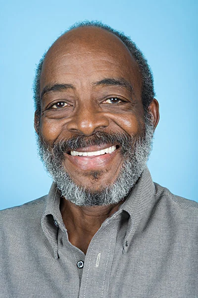 man smiling after getting his teeth restored at Gaither Perio and Dental Implants