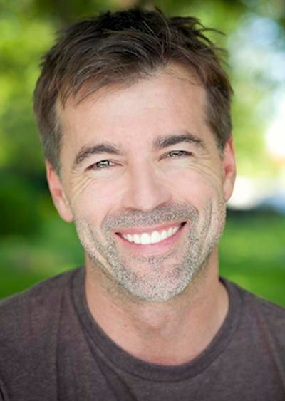 man loving the look of his freshly restored smile