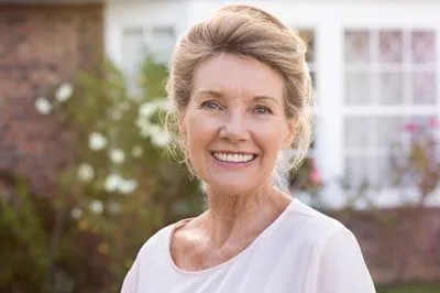 woman's gums restored thanks to pinhole gum rejuvenation