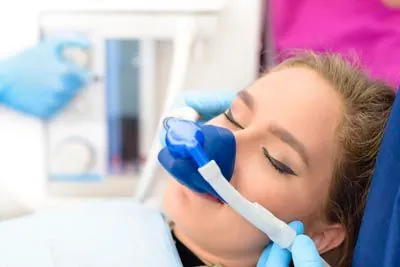 woman sleeping during her dental procedure